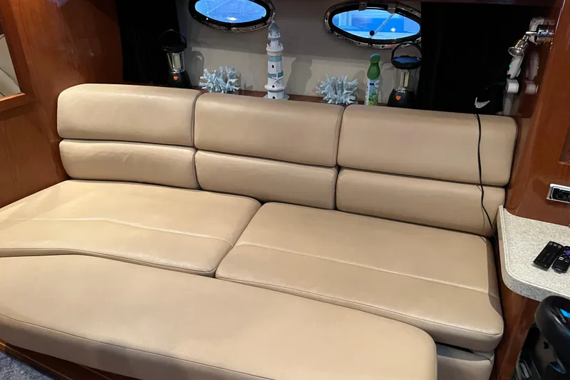 River Dancer Yacht Photos Pics Luxurious beige leather seating in 2007 Regal 3760 IB Commodore yacht interior.
