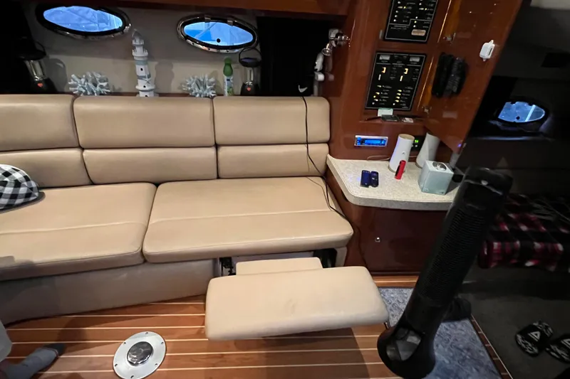 River Dancer Yacht Photos Pics Interior of 2007 Regal 3760 IB Commodore yacht with beige seating and control panels.