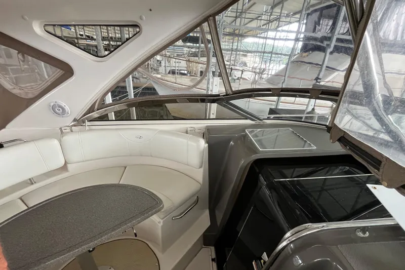 River Dancer Yacht Photos Pics Interior of 2007 Regal 3760 IB Commodore yacht with seating and kitchenette.