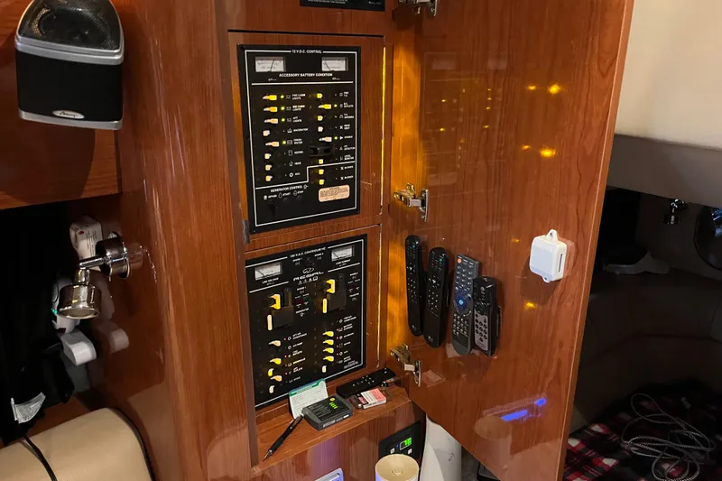 River Dancer Yacht Photos Pics Control panel inside 2007 Regal 3760 IB Commodore yacht with remotes and switches.