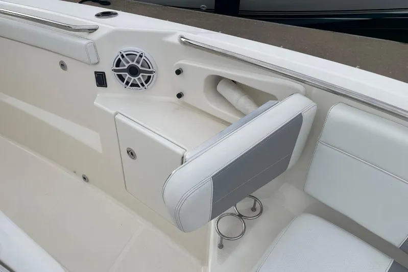 Equanimity Yacht Photos Pics 2021 Pursuit S 328 Sport boat interior with speaker and seating area.
