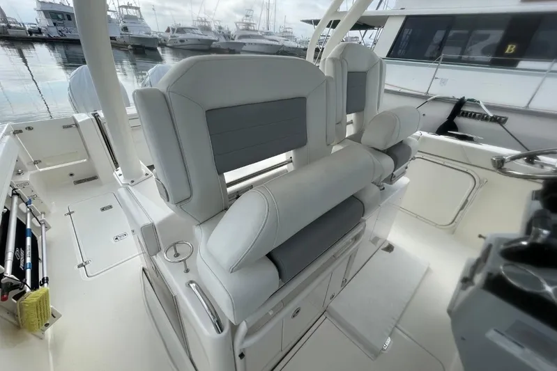 Equanimity Yacht Photos Pics 2021 Pursuit S 328 Sport boat interior with sleek seating and modern design.