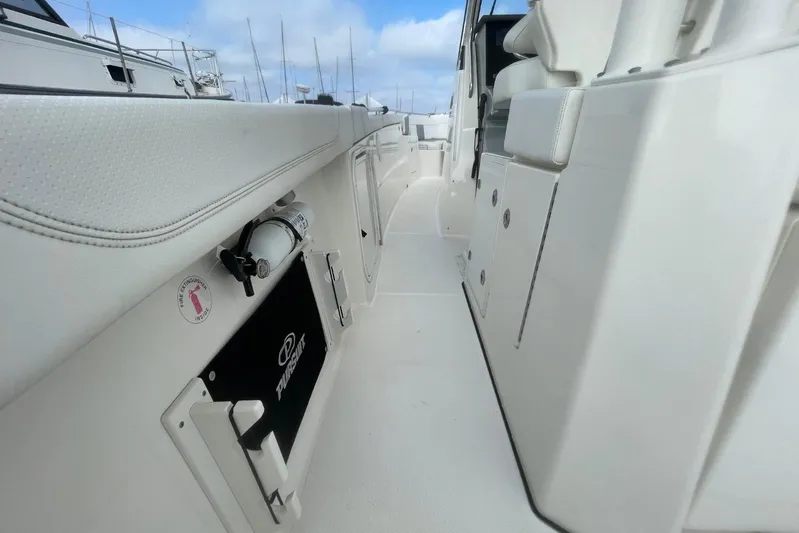 Equanimity Yacht Photos Pics 2021 Pursuit S 328 Sport boat interior with seating and safety equipment.