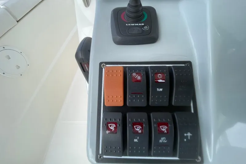 Equanimity Yacht Photos Pics Control panel of 2021 Pursuit S 328 Sport boat with switches and joystick.