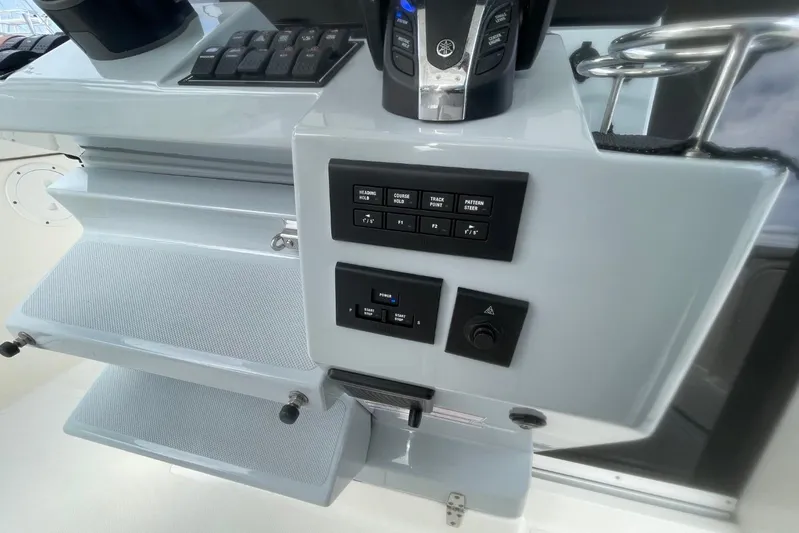 Equanimity Yacht Photos Pics Control panel of 2021 Pursuit S 328 Sport boat with various switches and controls.
