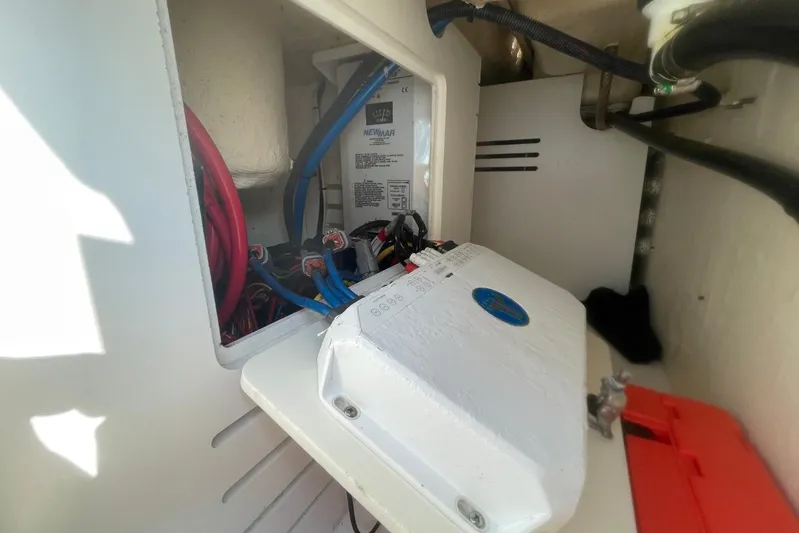 Equanimity Yacht Photos Pics Electrical components inside a 2021 Pursuit S 328 Sport boat, featuring wiring and equipment.