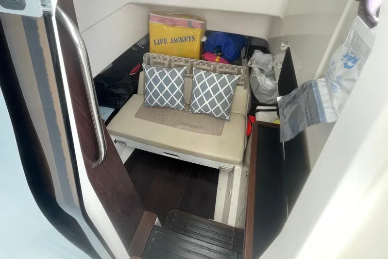 Equanimity Yacht Photos Pics Interior cabin of 2021 Pursuit S 328 Sport boat with cushions and life jackets.
