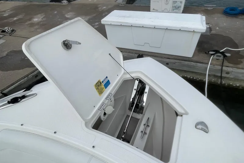 Equanimity Yacht Photos Pics 2021 Pursuit S 328 Sport boat with open storage compartment at dock.
