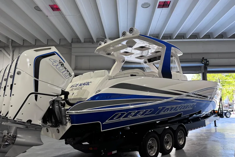  Yacht Photos Pics 2024 Deep Impact 399 Sport boat with powerful engines in a showroom.