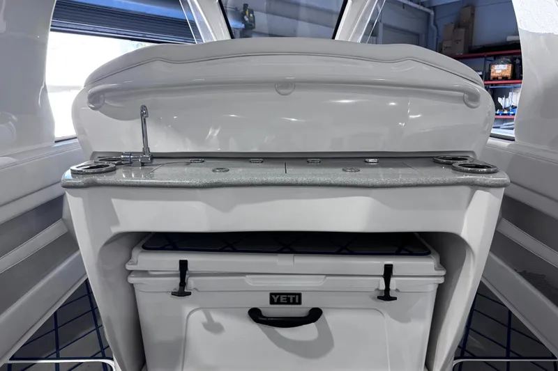  Yacht Photos Pics 2024 Deep Impact 399 Sport boat interior with Yeti cooler and sleek countertop design.