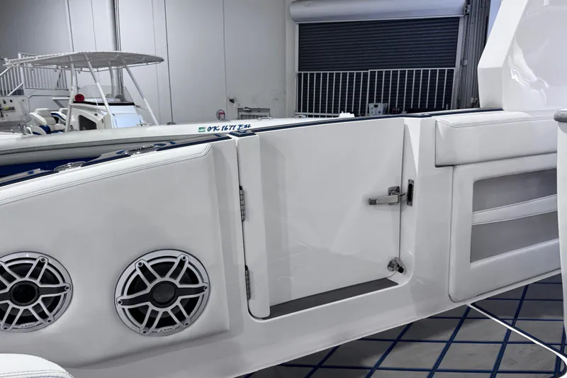  Yacht Photos Pics 2024 Deep Impact 399 Sport boat interior with speakers and storage compartments.