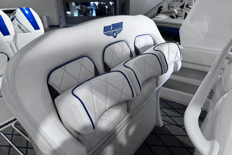  Yacht Photos Pics 2024 Deep Impact 399 Sport boat interior with luxurious white and blue seating.