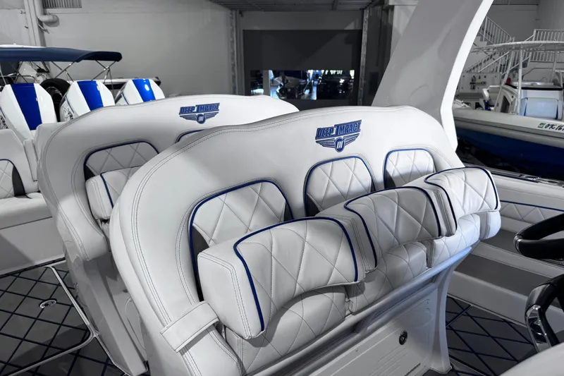  Yacht Photos Pics 2024 Deep Impact 399 Sport boat interior with luxurious white and blue seating.
