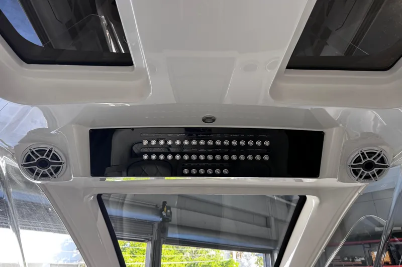  Yacht Photos Pics Interior view of 2024 Deep Impact 399 Sport boat with speakers and control panel.