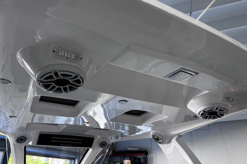  Yacht Photos Pics 2024 Deep Impact 399 Sport boat interior with speakers and lighting fixtures.