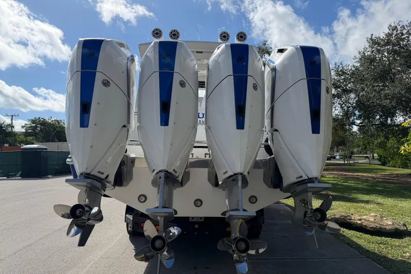  Yacht Photos Pics Four powerful outboard motors on a 2024 Deep Impact 399 Sport boat.