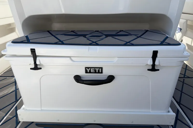  Yacht Photos Pics YETI cooler on 2024 Deep Impact 399 Sport boat deck, featuring secure latches and handle.