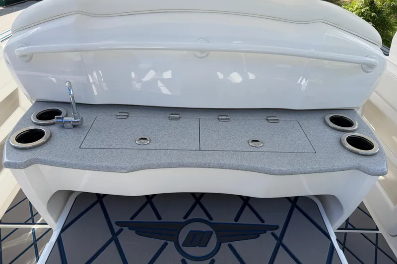  Yacht Photos Pics 2024 Deep Impact 399 Sport boat interior with sink and cup holders.