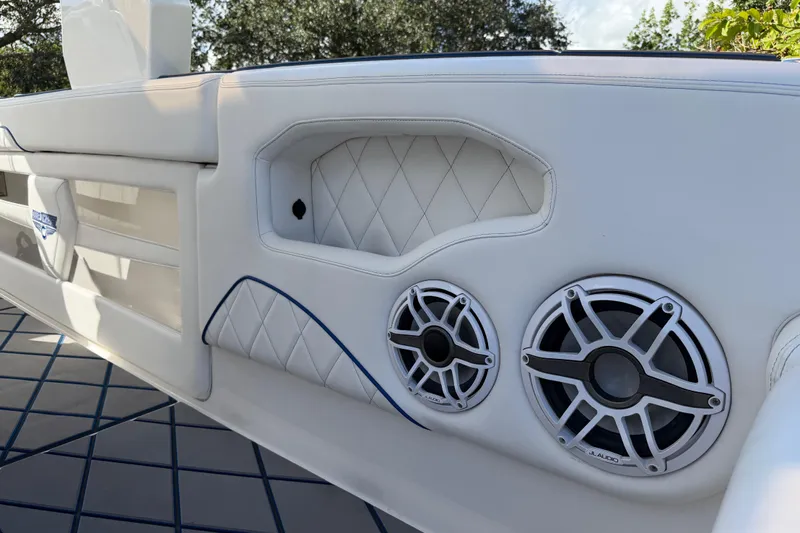  Yacht Photos Pics 2024 Deep Impact 399 Sport boat interior with JL Audio speakers and quilted upholstery.