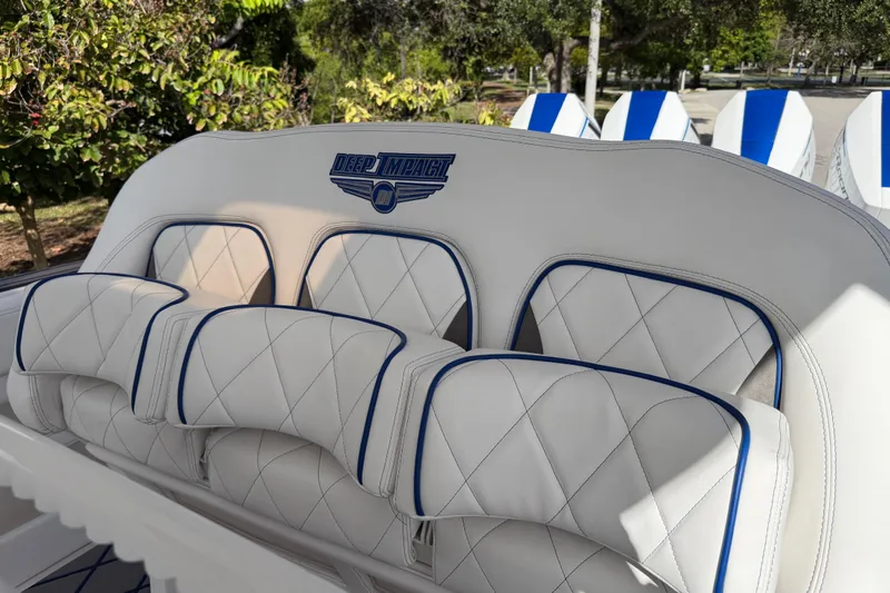  Yacht Photos Pics 2024 Deep Impact 399 Sport boat seats with white and blue diamond stitching.