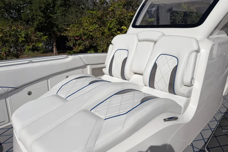  Yacht Photos Pics 2024 Deep Impact 399 Sport boat with luxurious white seating and sleek design.