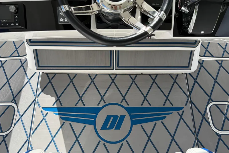  Yacht Photos Pics 2024 Deep Impact 399 Sport boat interior with steering wheel and custom flooring design.