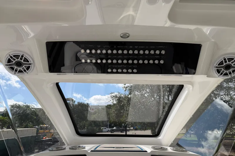  Yacht Photos Pics Interior view of 2024 Deep Impact 399 Sport boat dashboard with control panel and speakers.