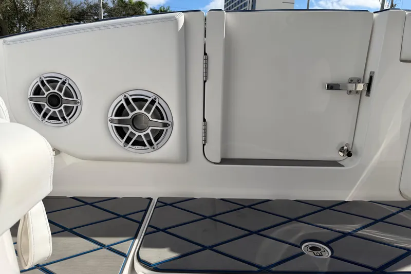  Yacht Photos Pics 2024 Deep Impact 399 Sport boat interior with speakers and storage compartment.