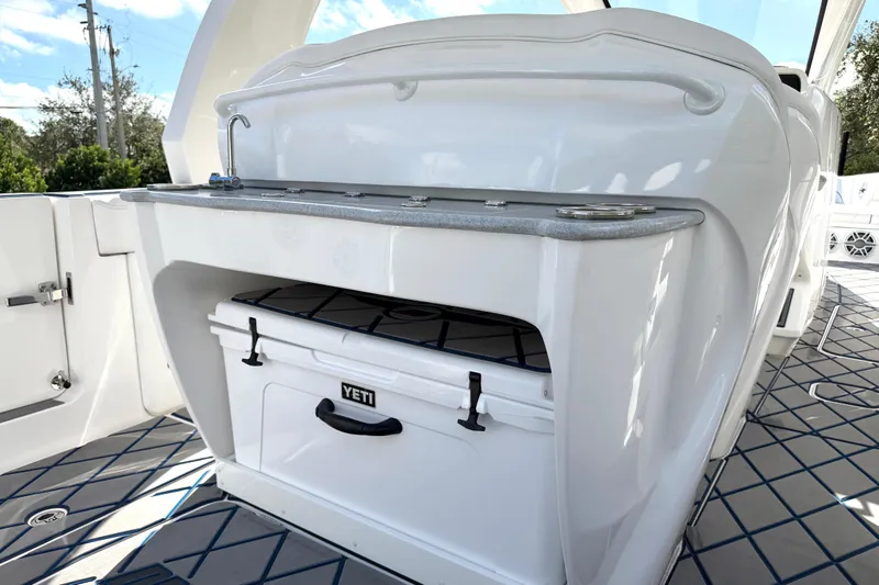  Yacht Photos Pics 2024 Deep Impact 399 Sport boat interior with Yeti cooler and sleek countertop design.