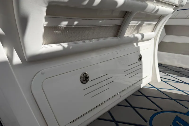  Yacht Photos Pics 2024 Deep Impact 399 Sport boat interior with white seating and storage compartment.