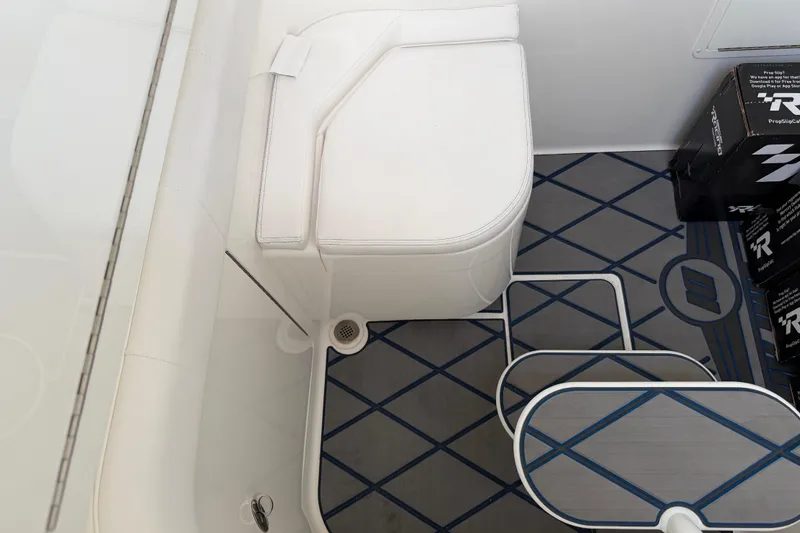  Yacht Photos Pics 2024 Deep Impact 399 Sport interior with white seating and patterned flooring.