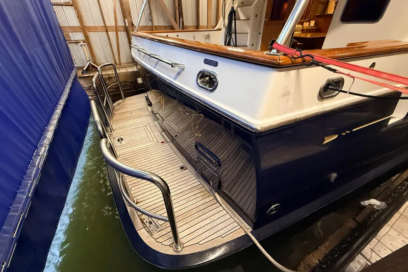 Ocean Osprey Yacht Photos Pics 2006 Selene 57 yacht docked in a marina, showcasing elegant design and craftsmanship.