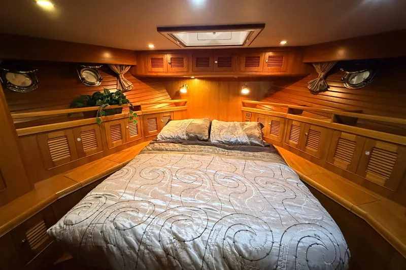 Ocean Osprey Yacht Photos Pics Luxurious cabin interior of 2006 Selene 57 yacht with elegant wood finish.