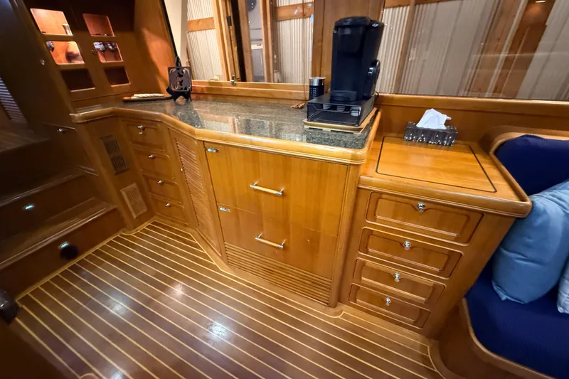 Ocean Osprey Yacht Photos Pics Luxurious wooden interior of 2006 Selene 57 yacht with modern amenities and elegant design.