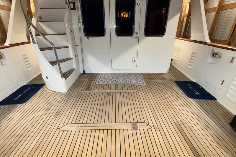 Ocean Osprey Yacht Photos Pics Luxurious 2006 Selene 57 yacht interior with wooden flooring and elegant staircase.