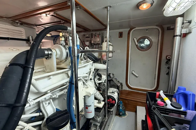 Ocean Osprey Yacht Photos Pics Engine room of a 2006 Selene 57 yacht, featuring mechanical components and storage.