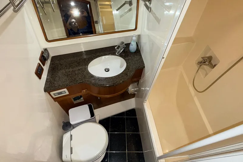 Ocean Osprey Yacht Photos Pics Luxurious bathroom in 2006 Selene 57 yacht with granite countertop and shower.