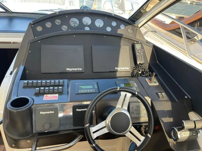  Yacht Photos Pics Control panel of a 2005 Sunseeker Mk1 yacht with Raymarine navigation equipment.