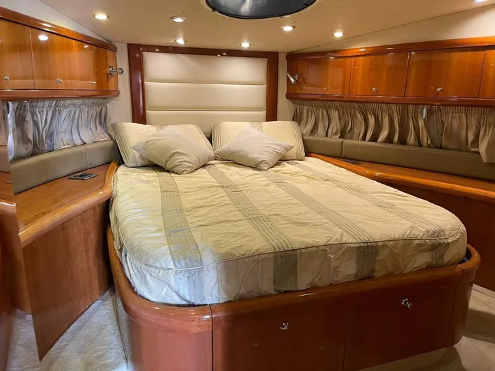  Yacht Photos Pics Luxurious Sunseeker Mk1 2005 yacht bedroom with elegant wood finish and cozy bedding.