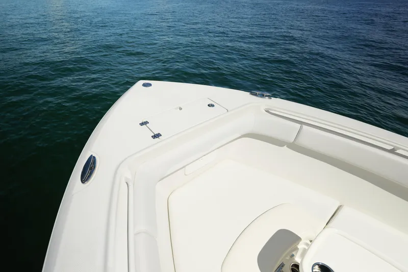  Yacht Photos Pics Bow of 2015 Sailfish 320 CC boat on calm water.