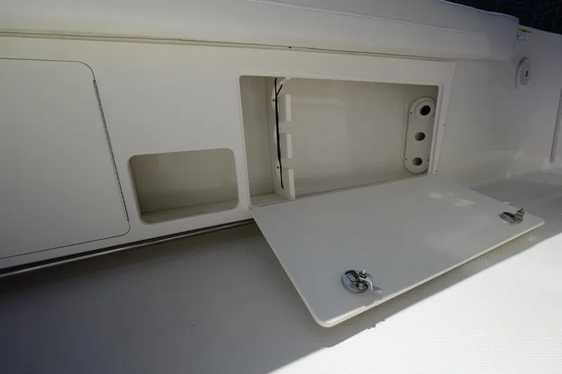  Yacht Photos Pics Open storage compartment on 2015 Sailfish 320 CC boat deck.