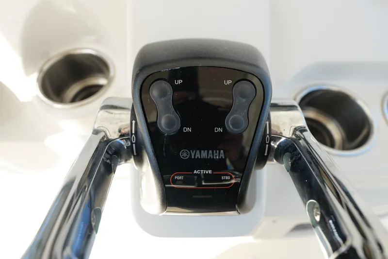  Yacht Photos Pics Yamaha throttle control on 2015 Sailfish 320 CC boat, featuring dual levers and trim buttons.