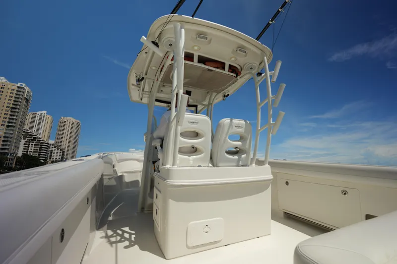 Yacht Photos Pics 2015 Sailfish 320 CC boat interior with seating, under clear blue sky.