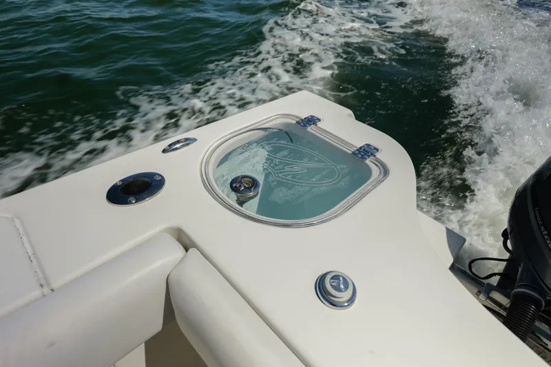  Yacht Photos Pics 2015 Sailfish 320 CC boat detail with water splashing in the background.