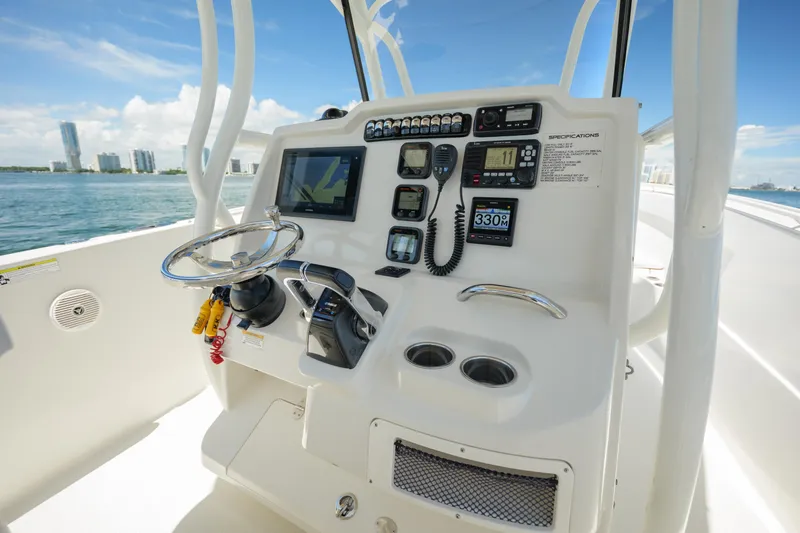  Yacht Photos Pics Control panel of a 2015 Sailfish 320 CC boat with navigation instruments.