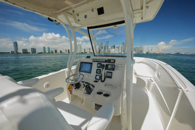  Yacht Photos Pics 2015 Sailfish 320 CC boat interior with city skyline view.