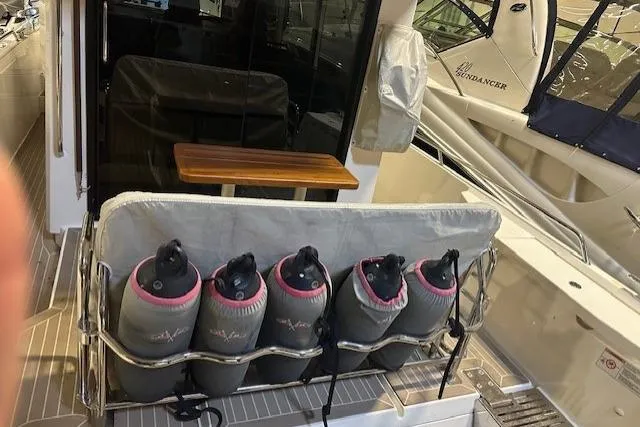  Yacht Photos Pics 2023 Nimbus C11 boat with fenders stored on the deck, showcasing sleek design and functionality.