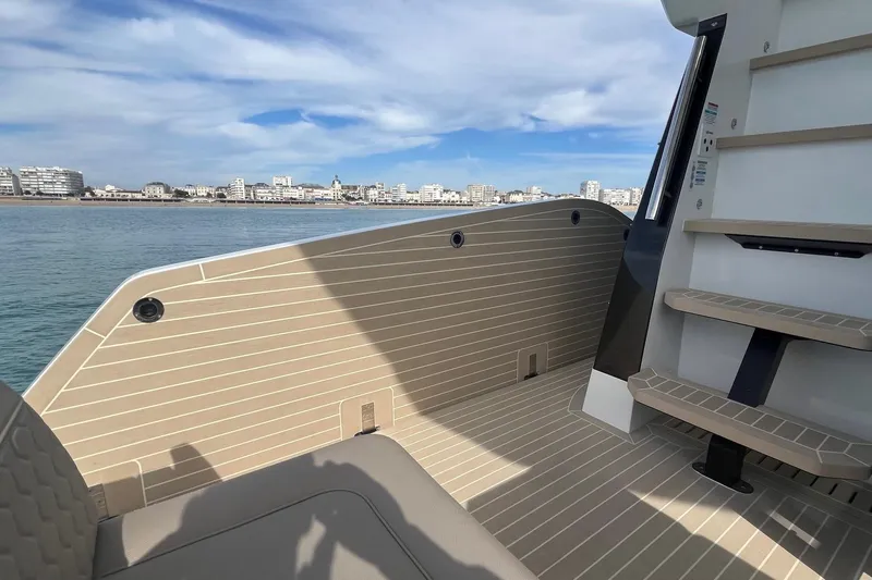  Yacht Photos Pics 2026 Galeon 400 Fly yacht deck with city skyline and ocean view.