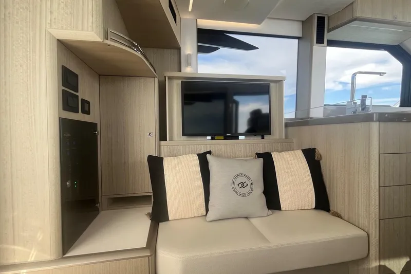  Yacht Photos Pics Luxurious interior of 2026 Galeon 400 Fly yacht with modern seating and TV.
