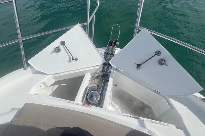  Yacht Photos Pics Bow view of 2026 Galeon 400 Fly yacht with open anchor compartments.